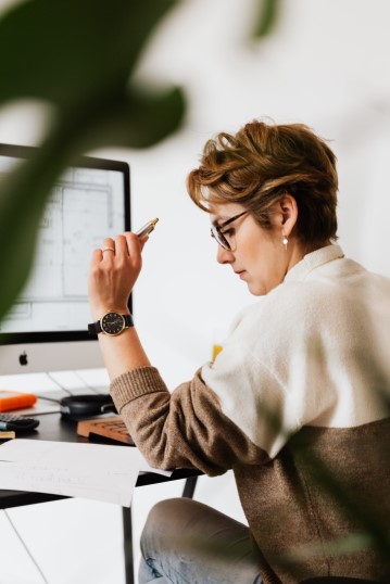 Focused Businesswoman Reading Documents